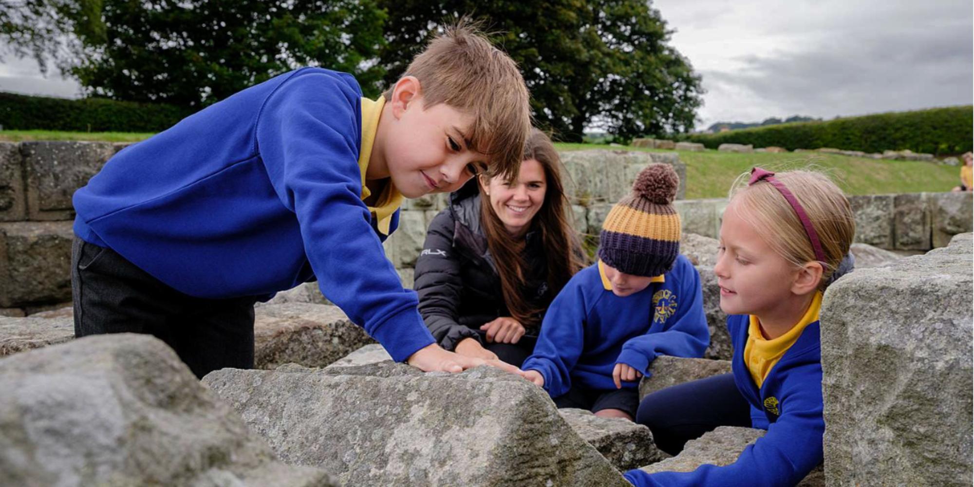School Children at Corbridge Roman Town exploring the remains
